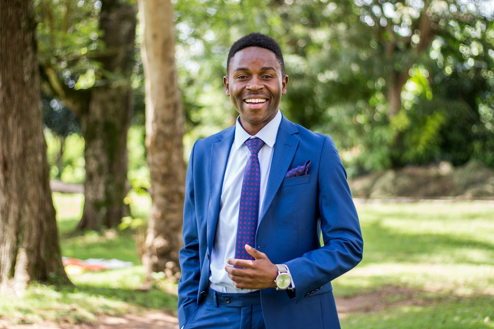 A smiling executive in a tailored blue suit